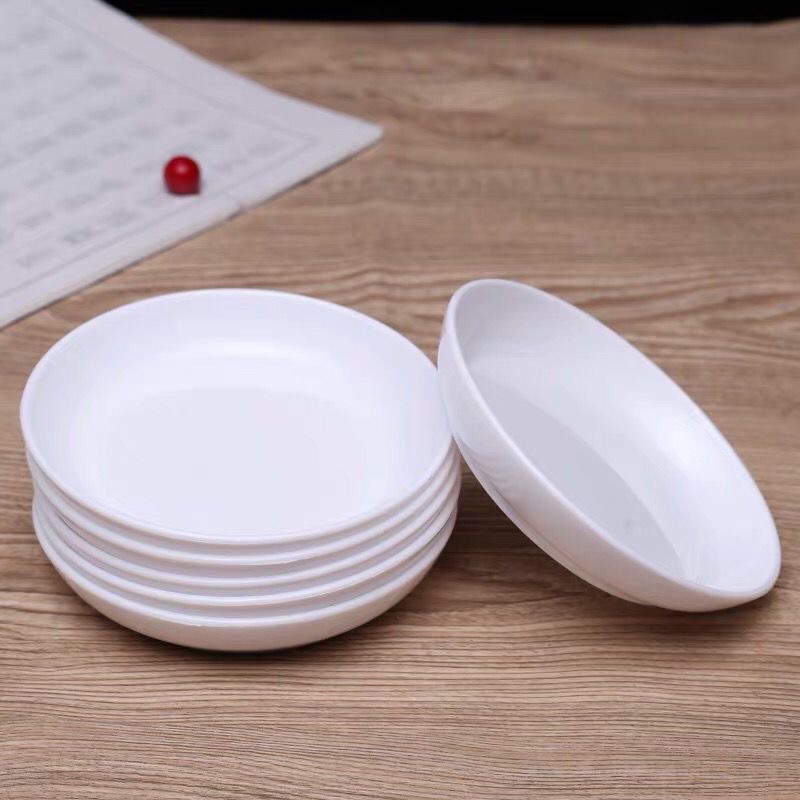 Stacked round paint dishes source view
